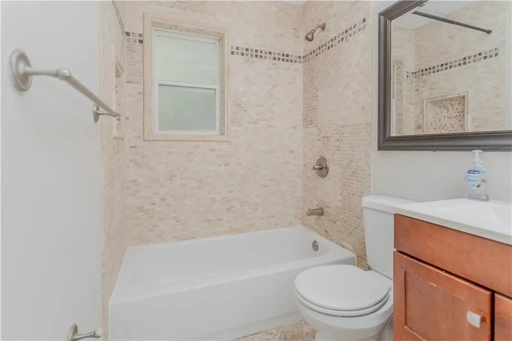 Full bath featuring vanity and tub / shower combination