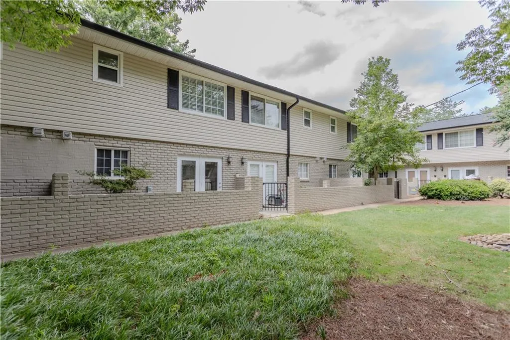 Back of house with brick siding