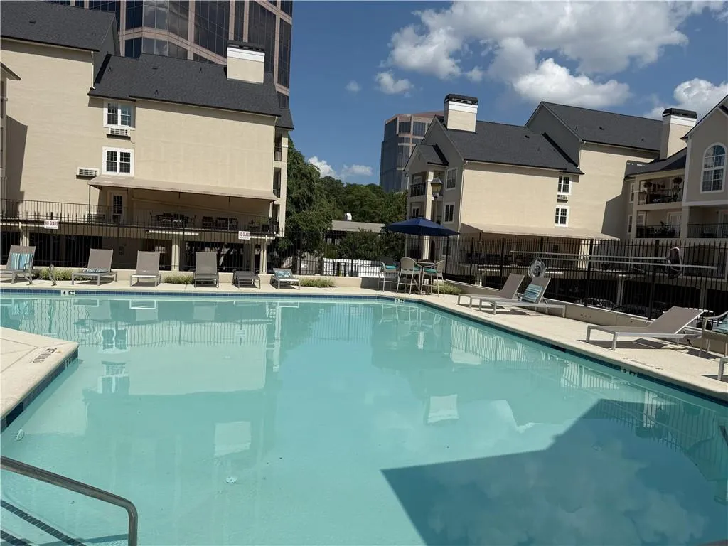 Community pool featuring a patio area