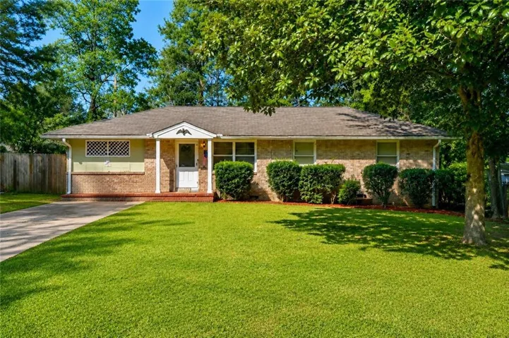 Brick and siding exterior with a gabled entry