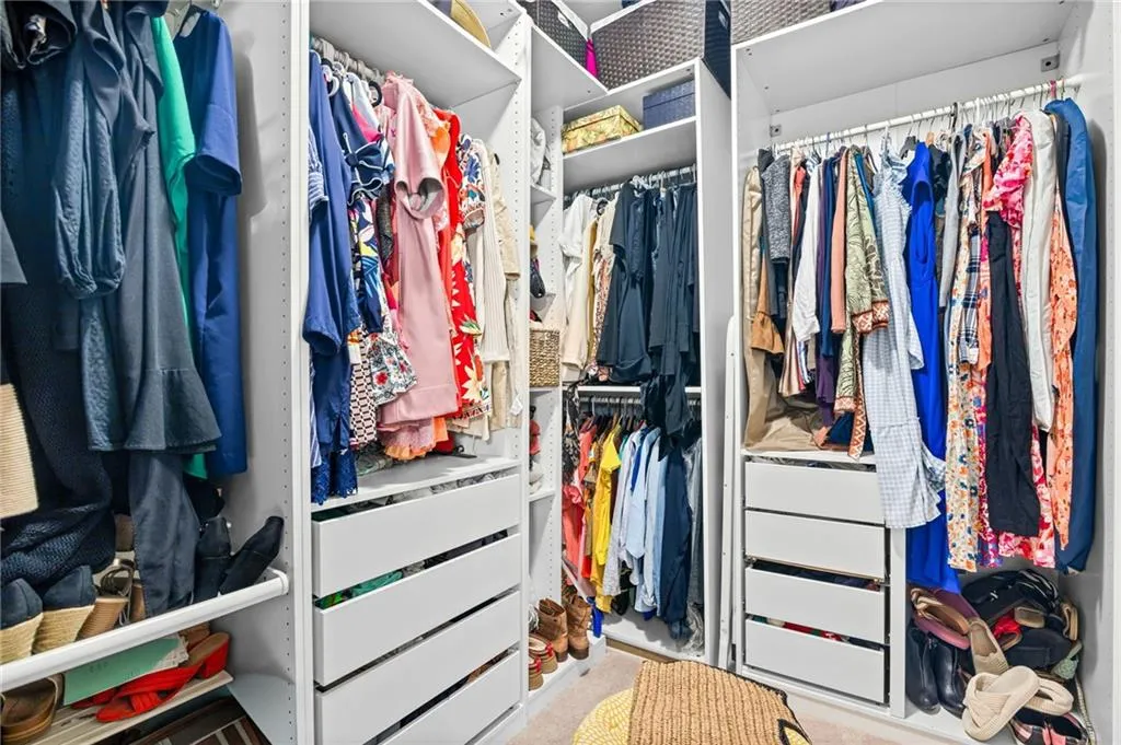 View of primary walk in closet