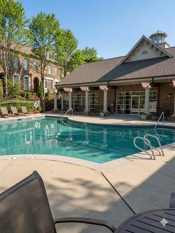 Community pool featuring a patio