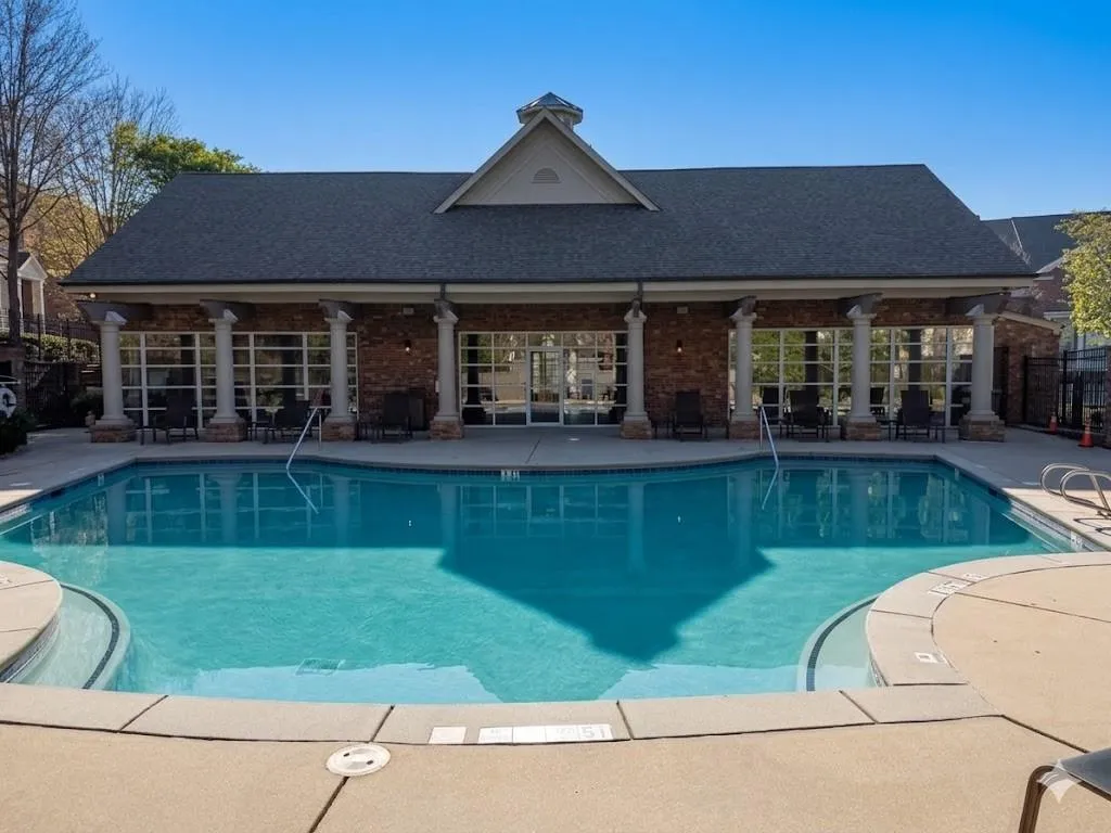 Community pool featuring a patio area
