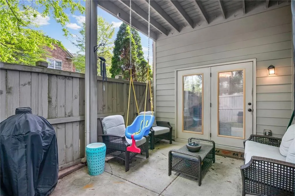 View of patio featuring grilling area, french doors, and outdoor lounge area