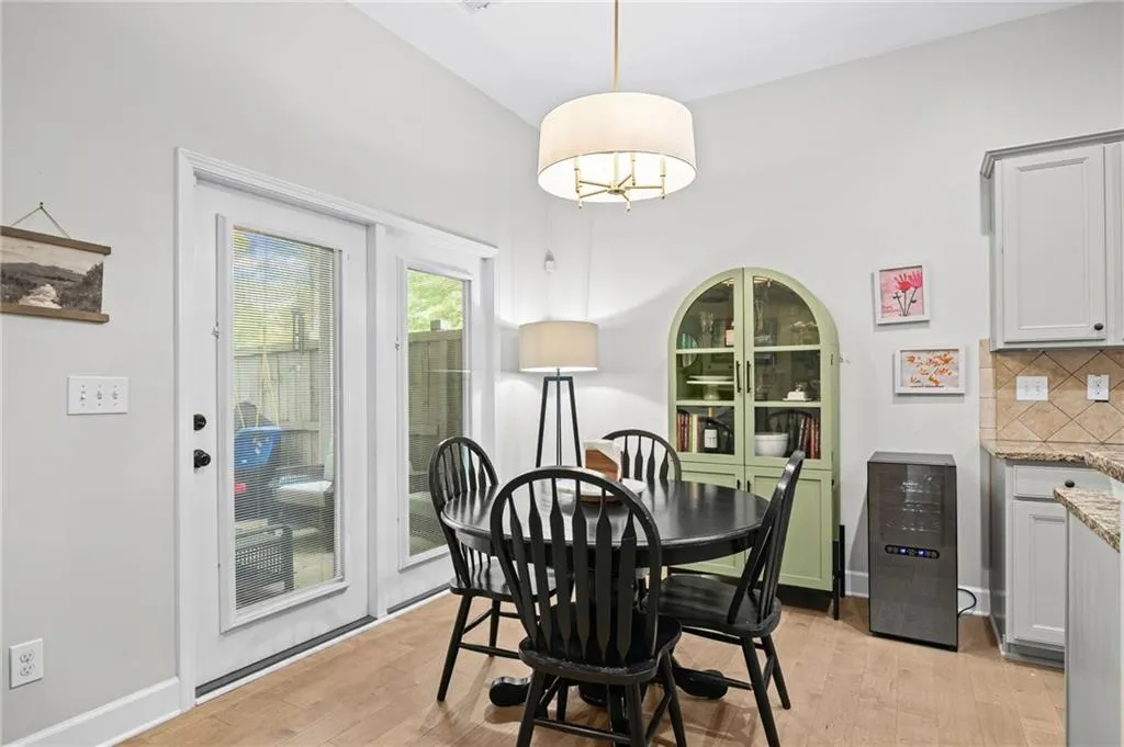 Breakfast Area with light wood-style flooring and baseboards