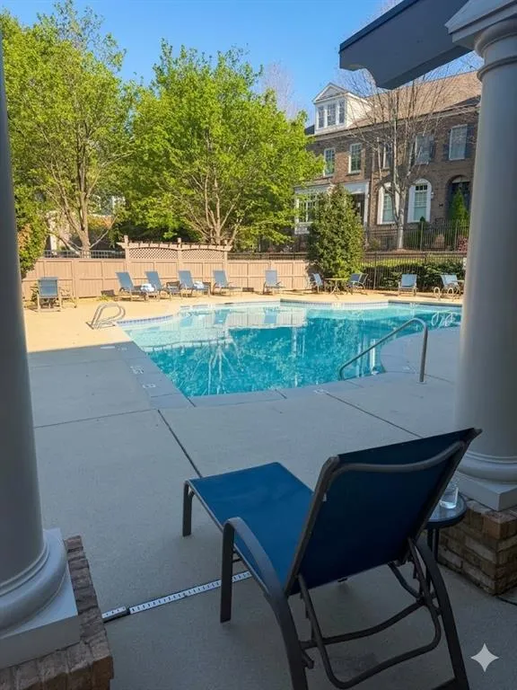 Community pool with a patio