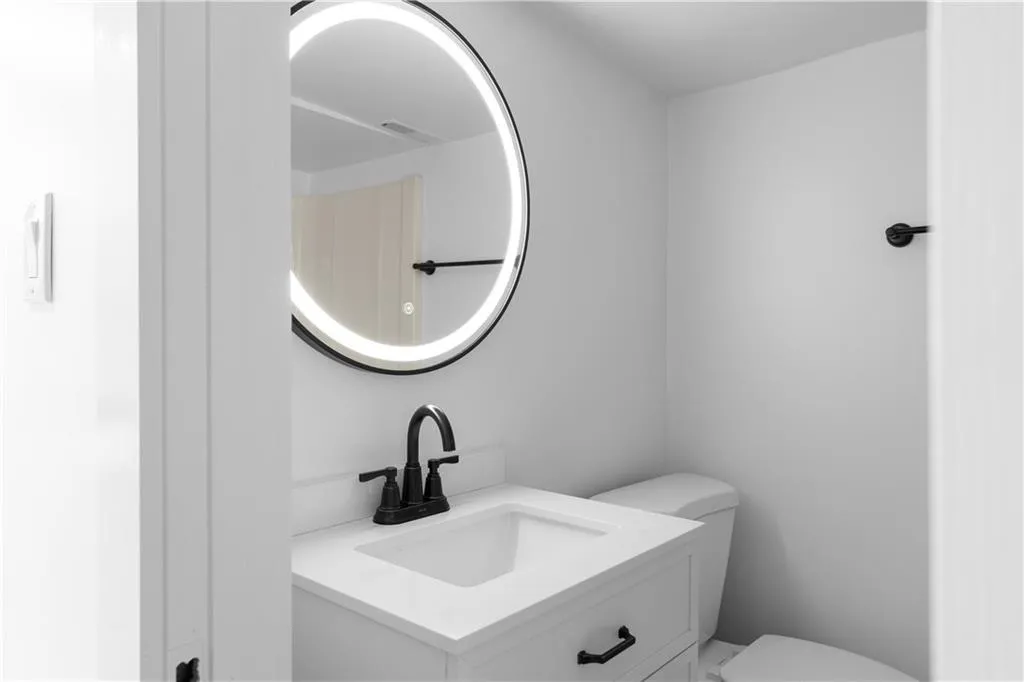 Bathroom with toilet and vanity