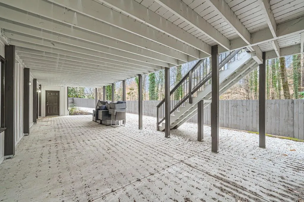 View of patio featuring stairs and a fenced backyard