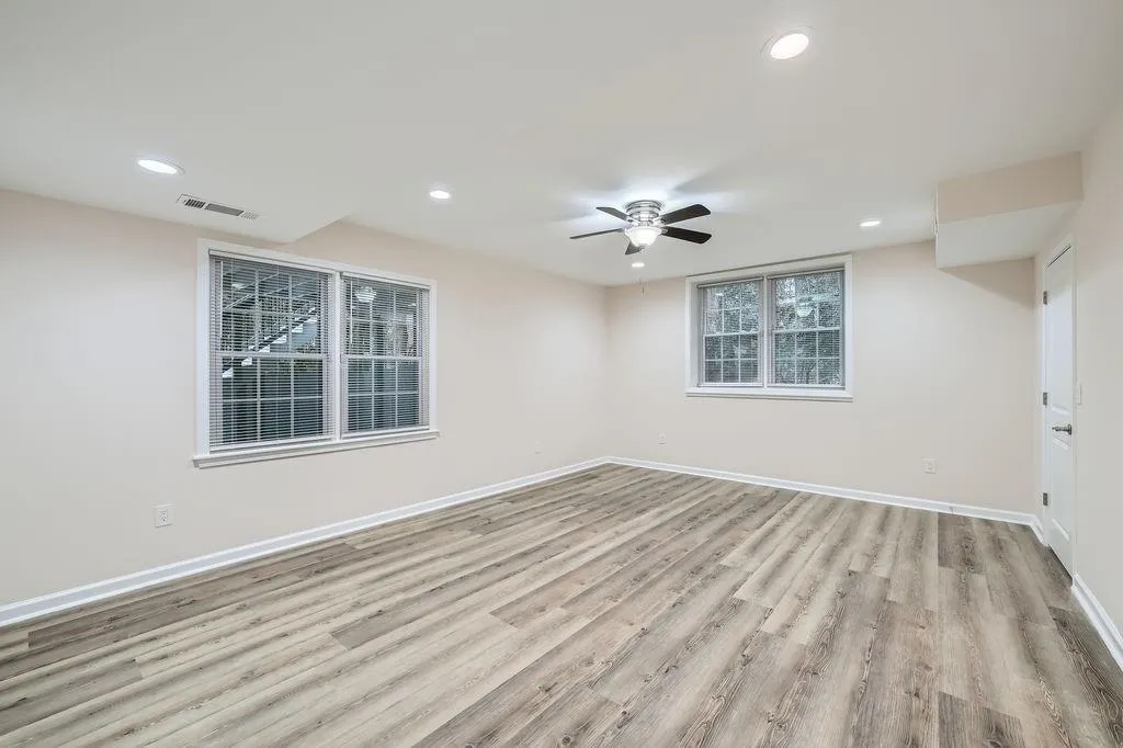 Spare room with baseboards, visible vents, wood finished floors, and recessed lighting