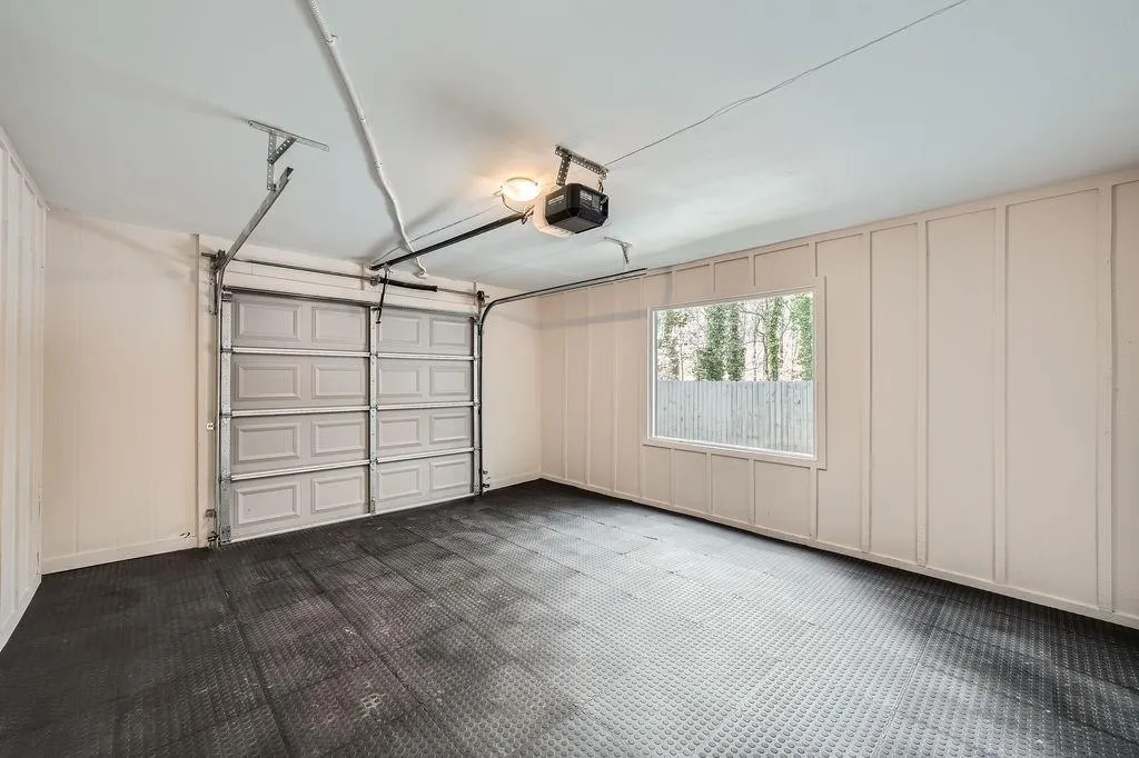 Garage with a decorative wall and a garage door opener