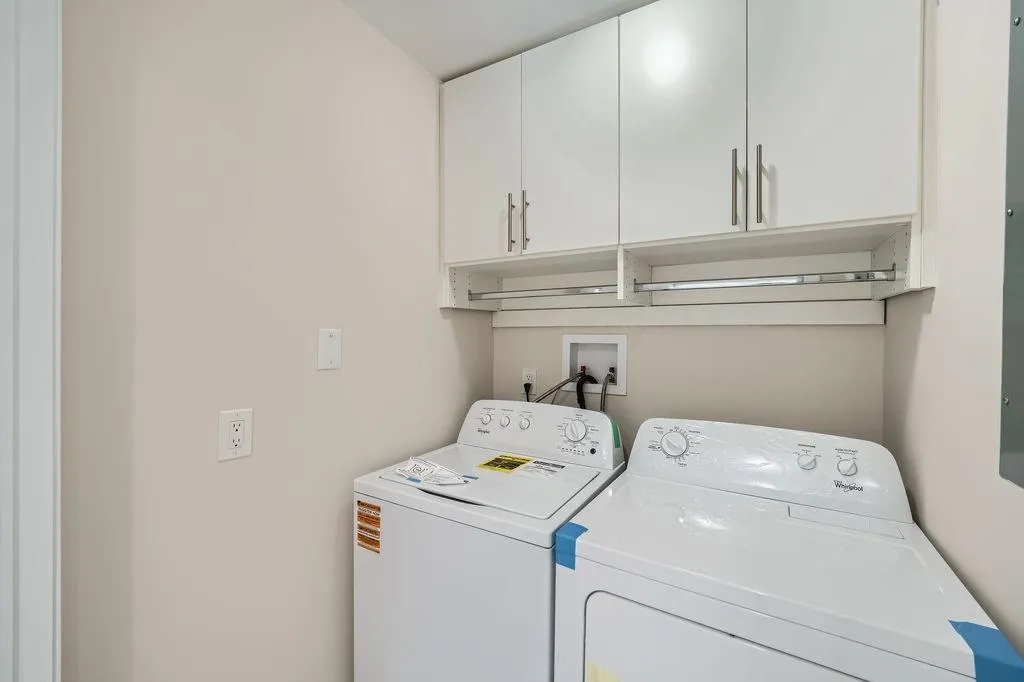Laundry area with washer and dryer and cabinet space