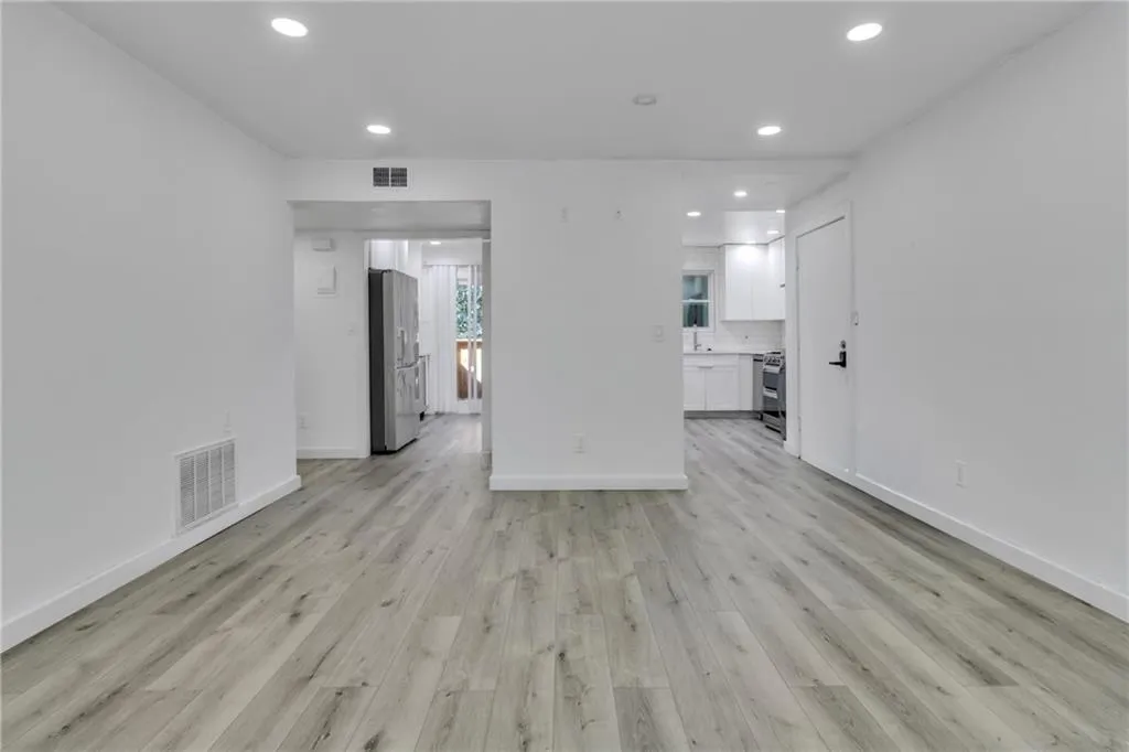 Unfurnished living room with recessed lighting and light wood-style flooring