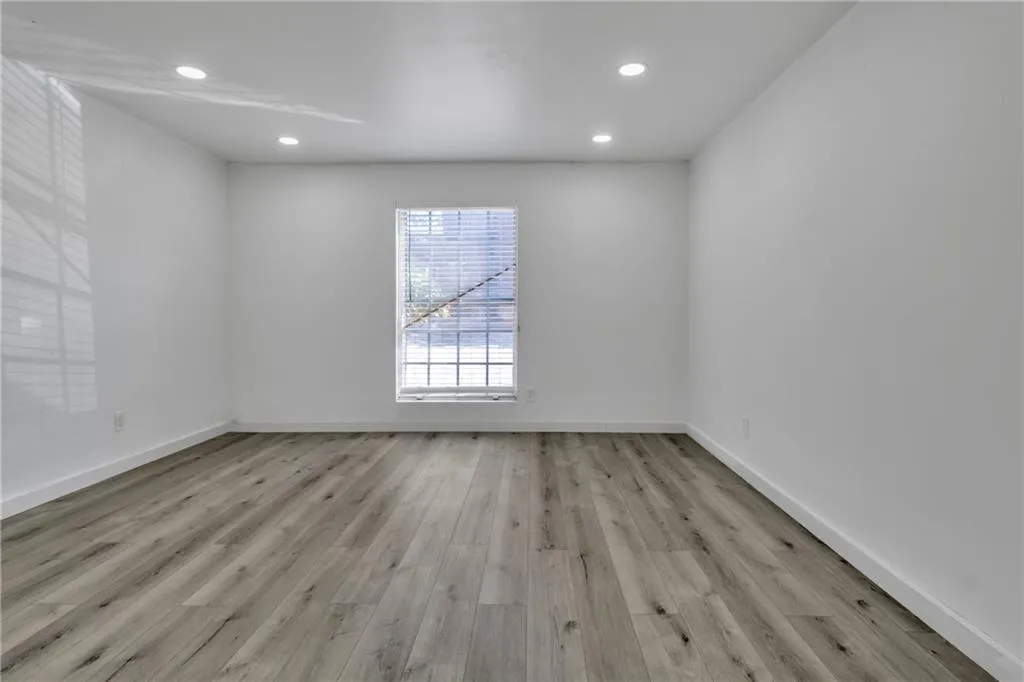Unfurnished room with recessed lighting and light wood-style flooring