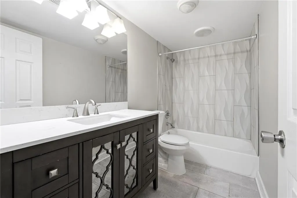 Full bathroom with vanity and bathing tub / shower combination
