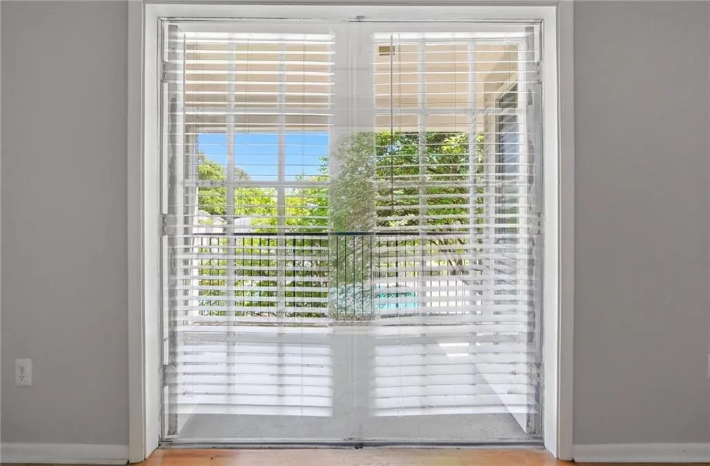 Doorway to outside featuring baseboards