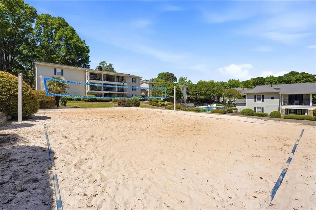 View of home's community featuring volleyball court