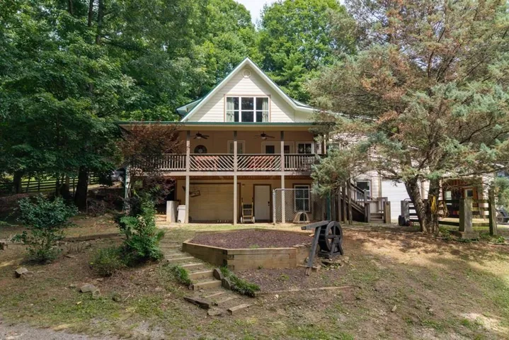 Two-story exterior with a gabled roof and covered balconies