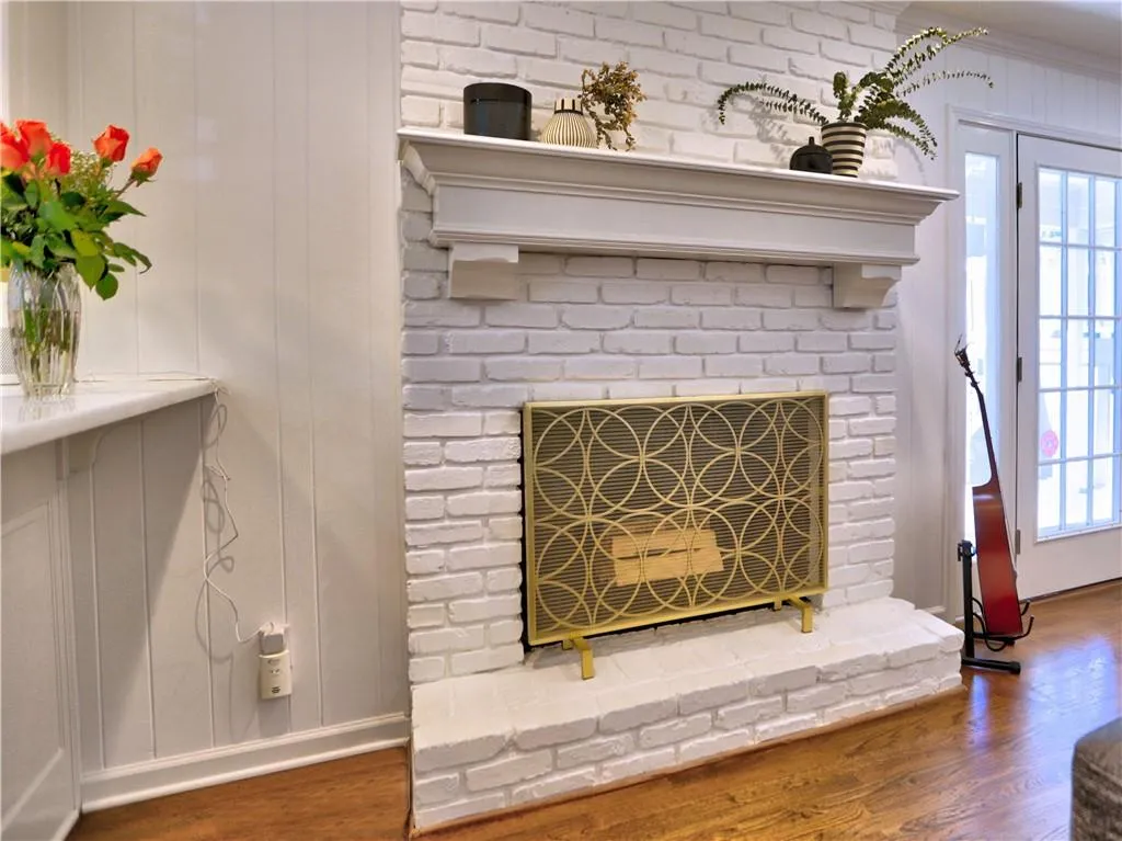 Room details featuring a fireplace and hardwood / wood-style floors