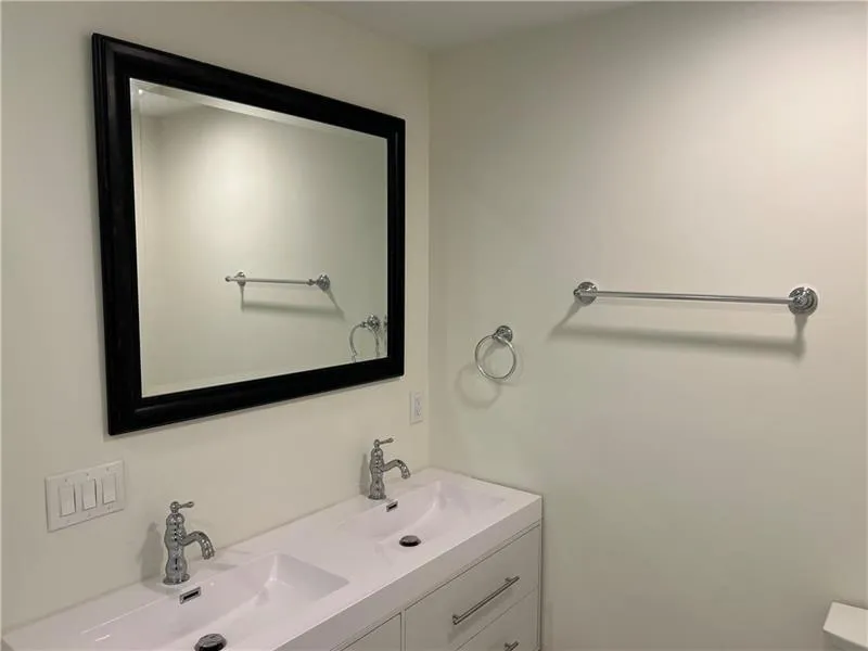 Full bathroom with double vanity