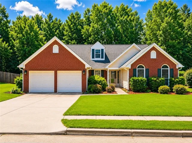 Brick exterior with decorative arched window accents