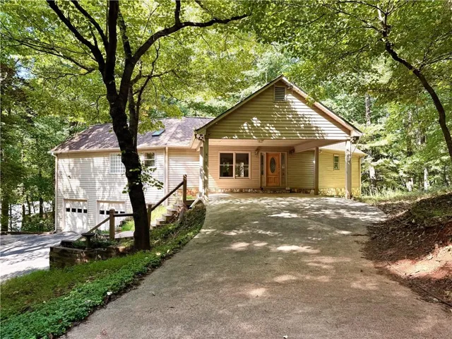 Wood-sided exterior with an attached two-car garage