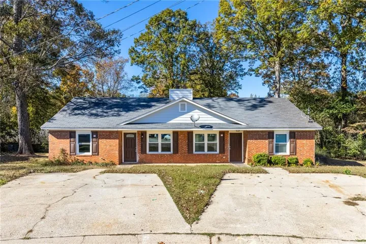 Brick duplex with dual entryways and individual driveways