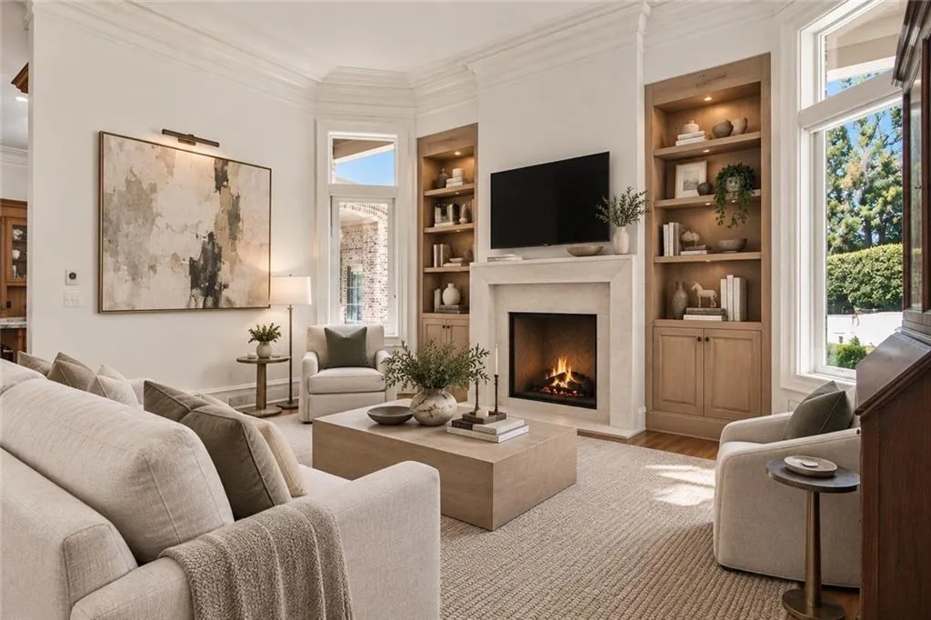 Virtually staged -- Refinished builtings, and new fireplace surround and mantle. Furnishings and decor are digitally rendered