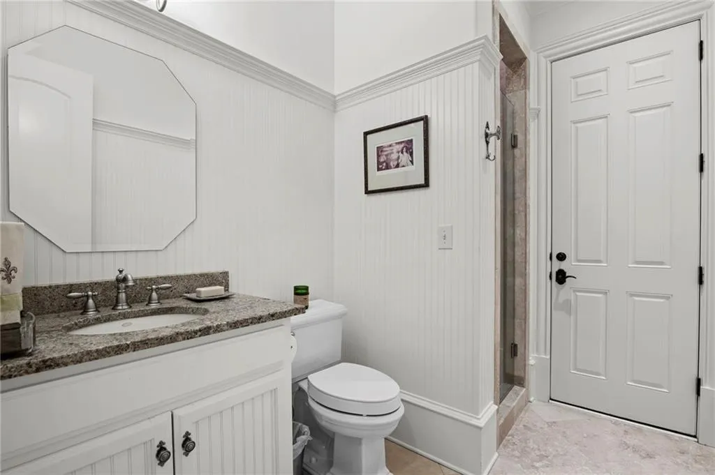 White wood paneling with crown molding