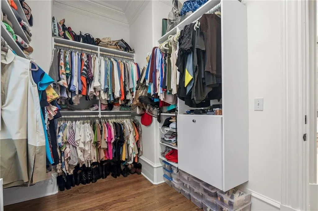 Custom closet organization system with wood-finish flooring