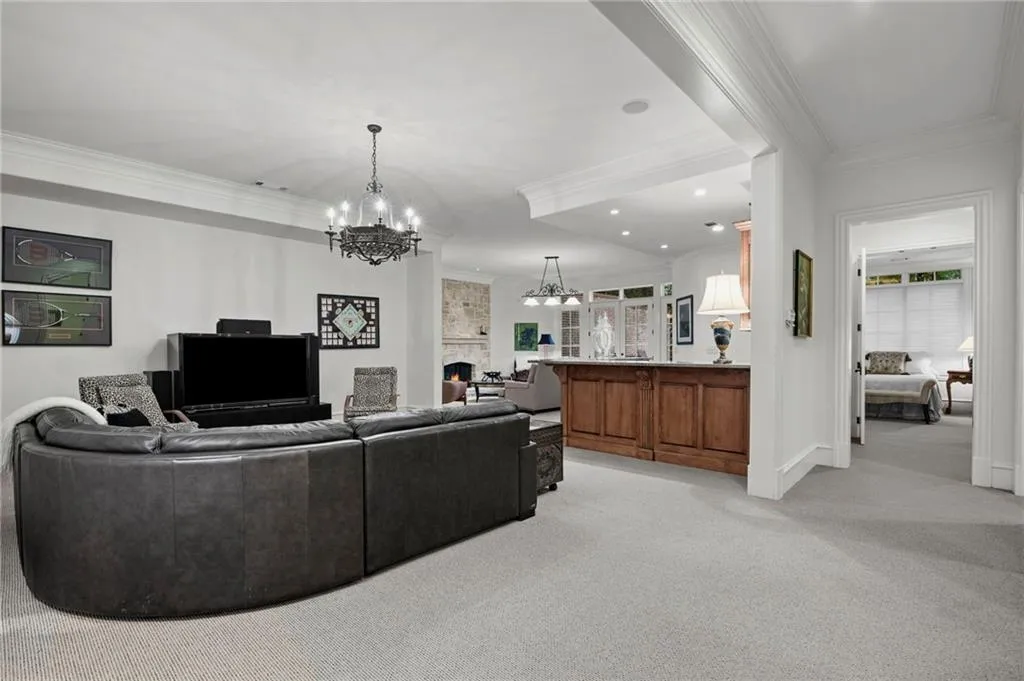 Terrace Level has Spacious entertainment area with recessed lighting and crown molding