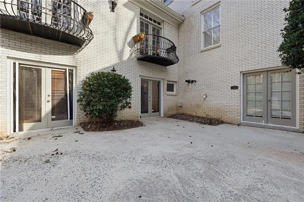 Entrance to property with french doors and brick siding