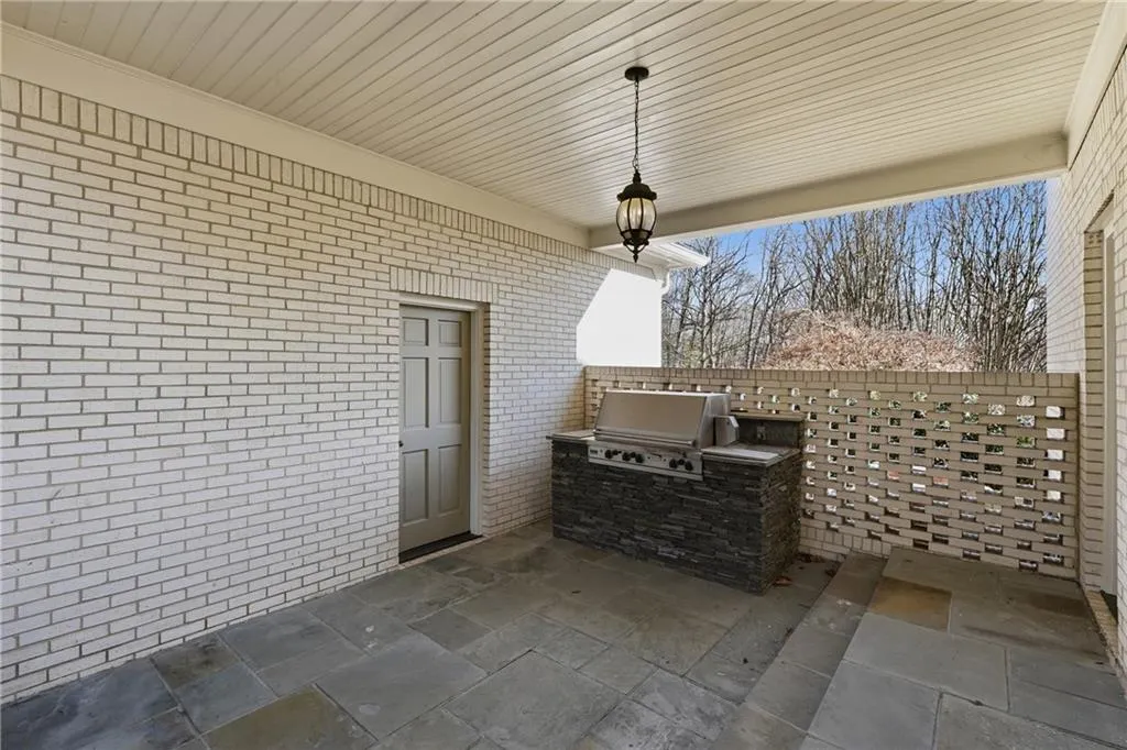 View of patio featuring area for grilling