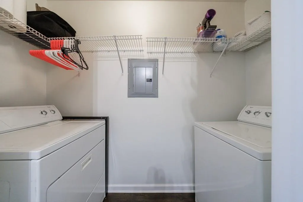 Clothes washing area with electric panel and washer and clothes dryer