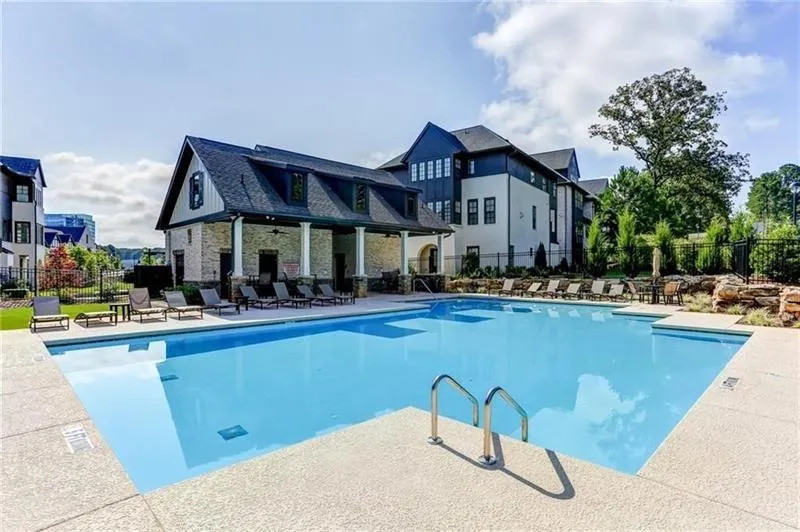 Community pool featuring a patio area