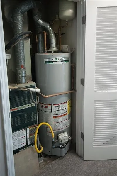 Utilities featuring gas water heater and heating unit