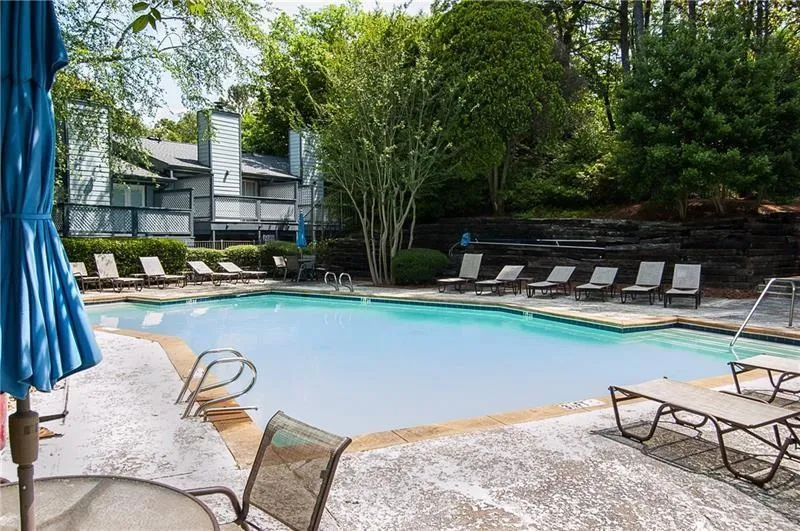 Community pool with a patio area