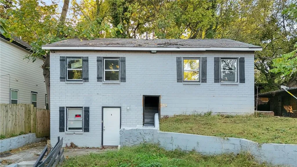 View of front of property with brick siding