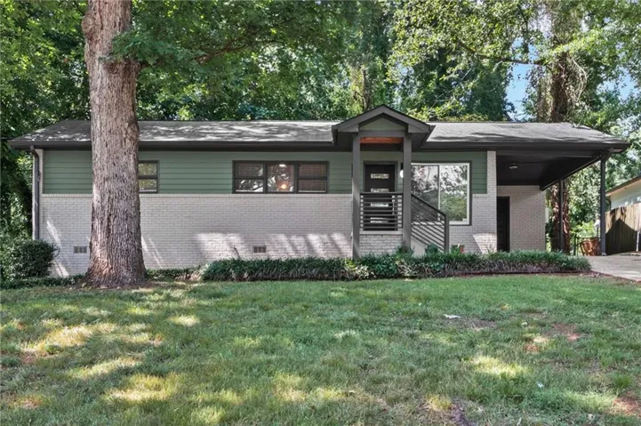 Contemporary exterior with painted brick and green siding