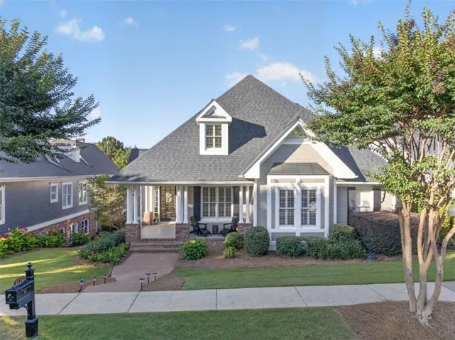Traditional exterior with a gabled roof and dormer windows