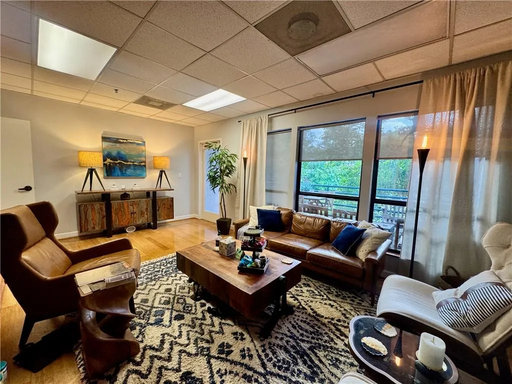 Featuring gorgeous views, hardwood flooring, built in cabinets, and a fish tank