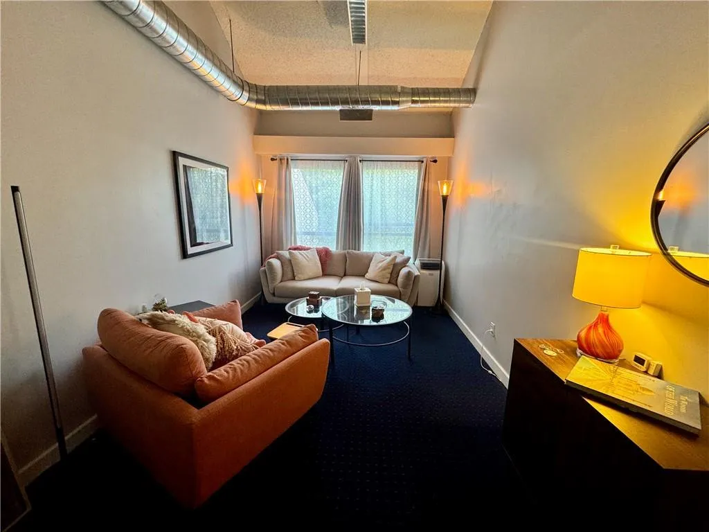 Featuring high ceilings, a window