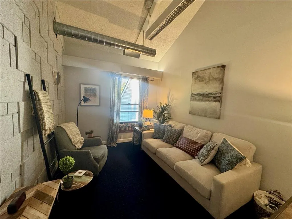 Featuring high ceilings, a window, and soundproofing