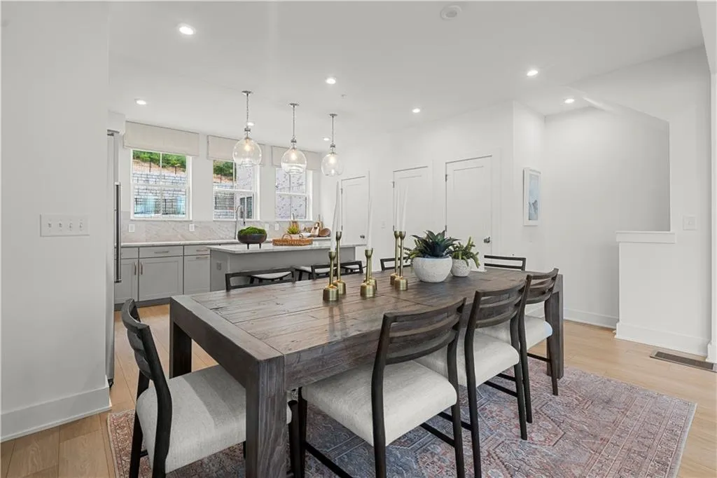 Dining room with light wood finished floors, baseboards, and recessed lighting*Furnished pictures are of model home*