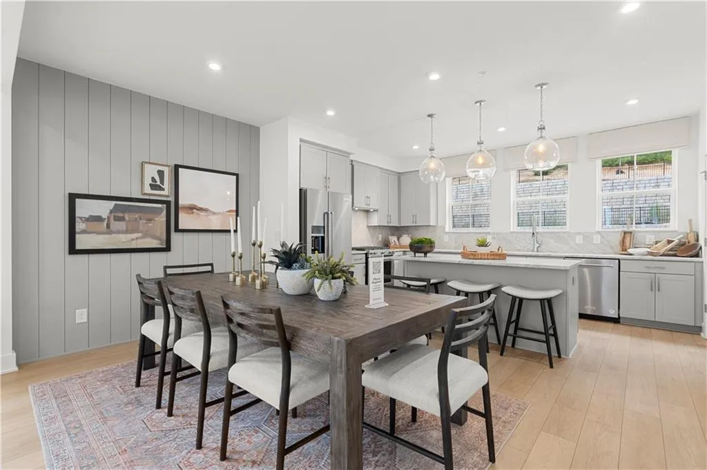 Dining room with plenty of natural light, light wood-type flooring, and recessed lighting *Furnished pictures are of model home*