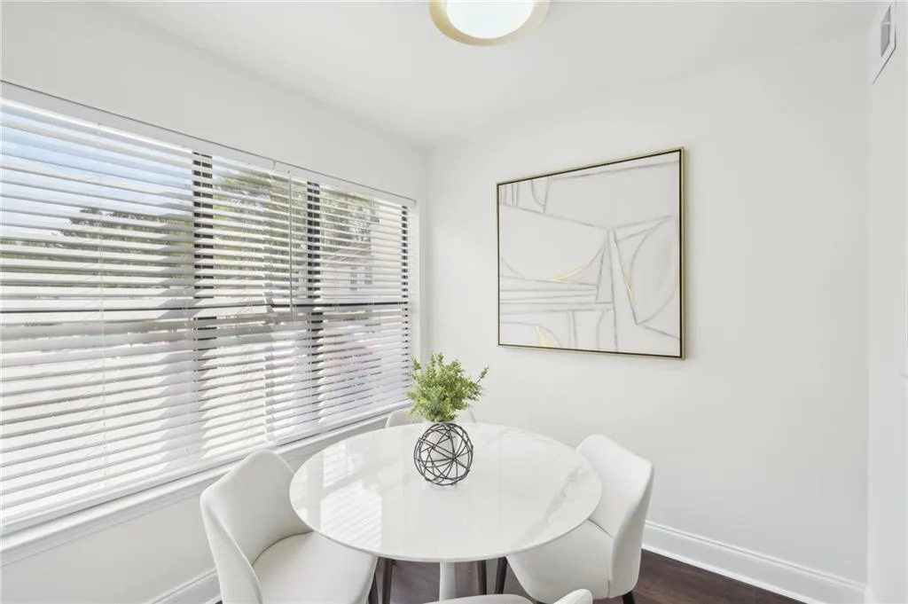 Dining room featuring baseboards, dark wood-style floors, and visible vents
