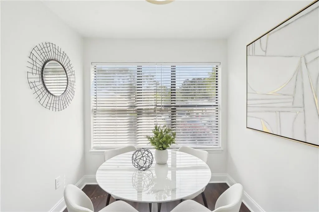Dining space featuring baseboards and wood finished floors