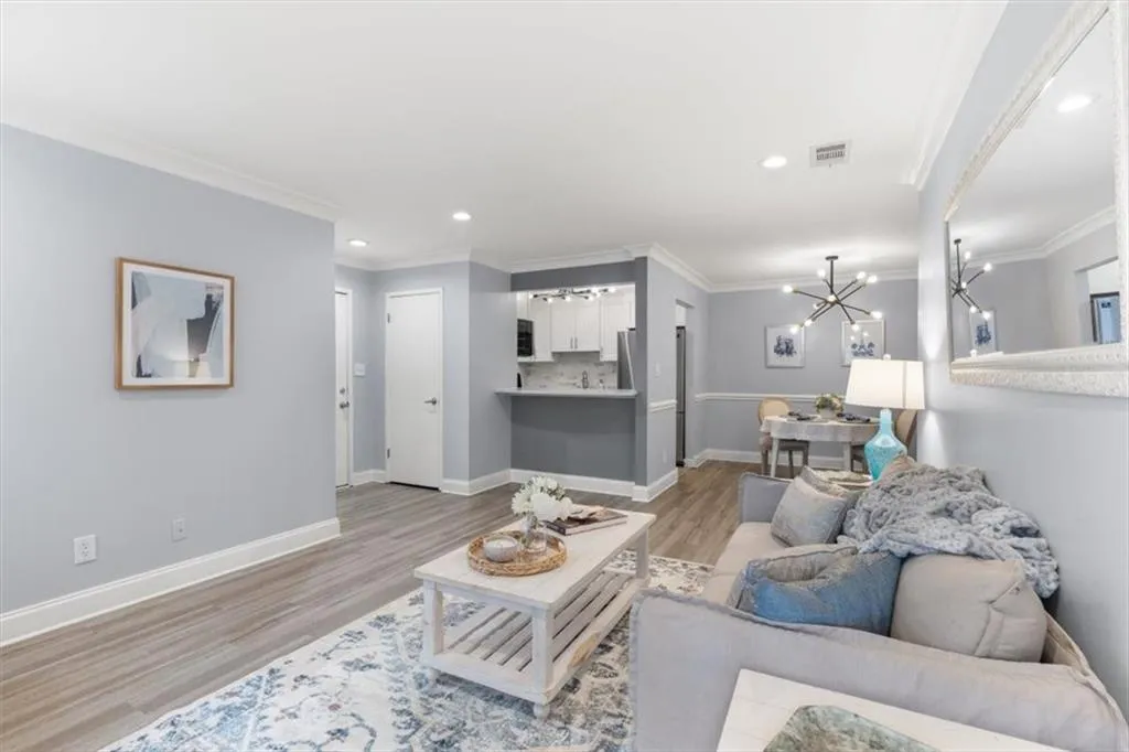 Living area featuring open concept, a chandelier, and recessed lighting