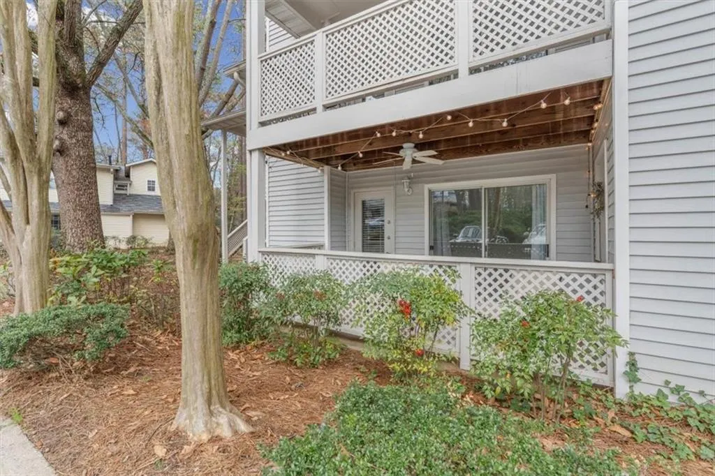 View of home's exterior with a ceiling fan and covered porch