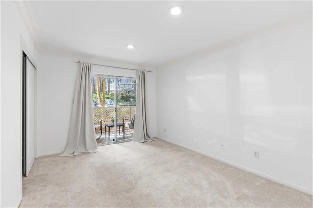 Unfurnished bedroom with custom closet, carpet, a closet, and recessed lighting