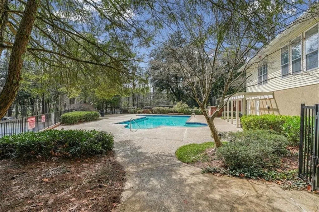 Community pool with a patio area